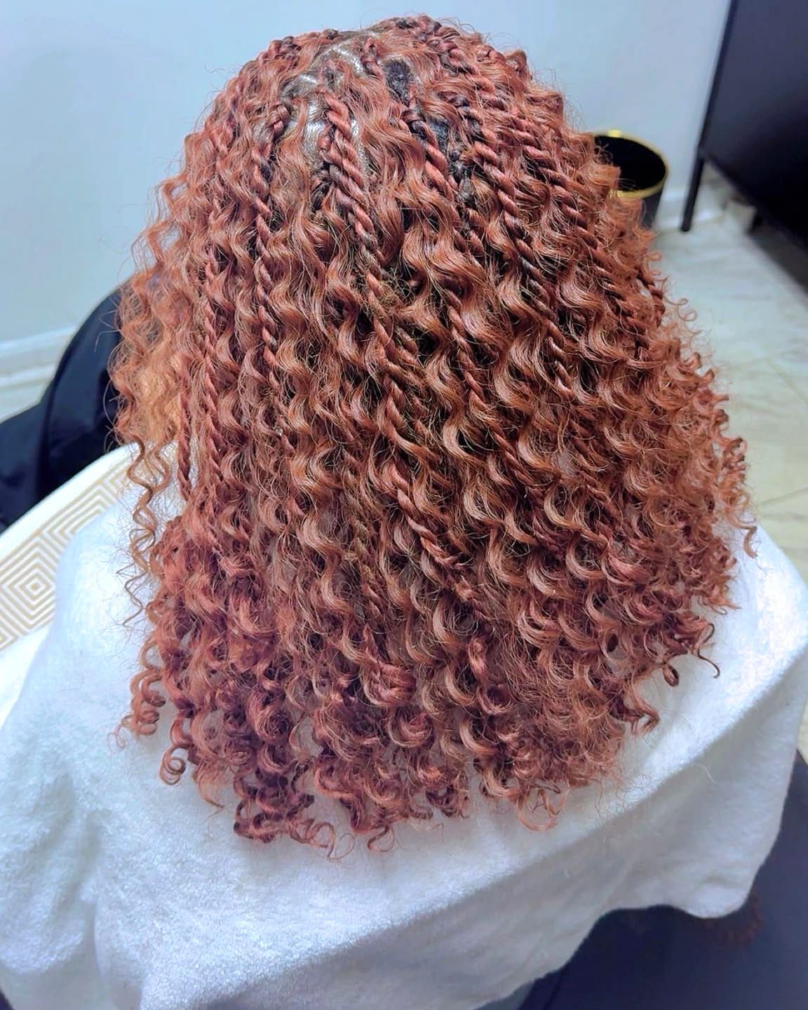 Copper island twists with full curly texture, back view