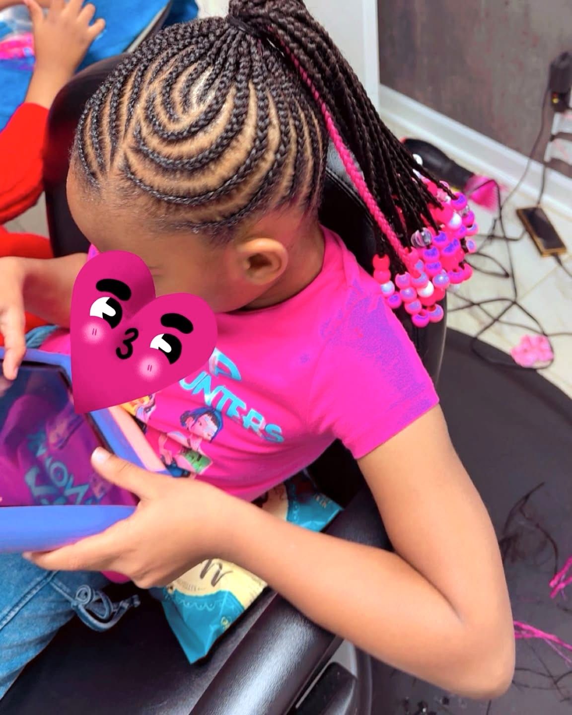 Kids cornrows with curved parts swept into braids