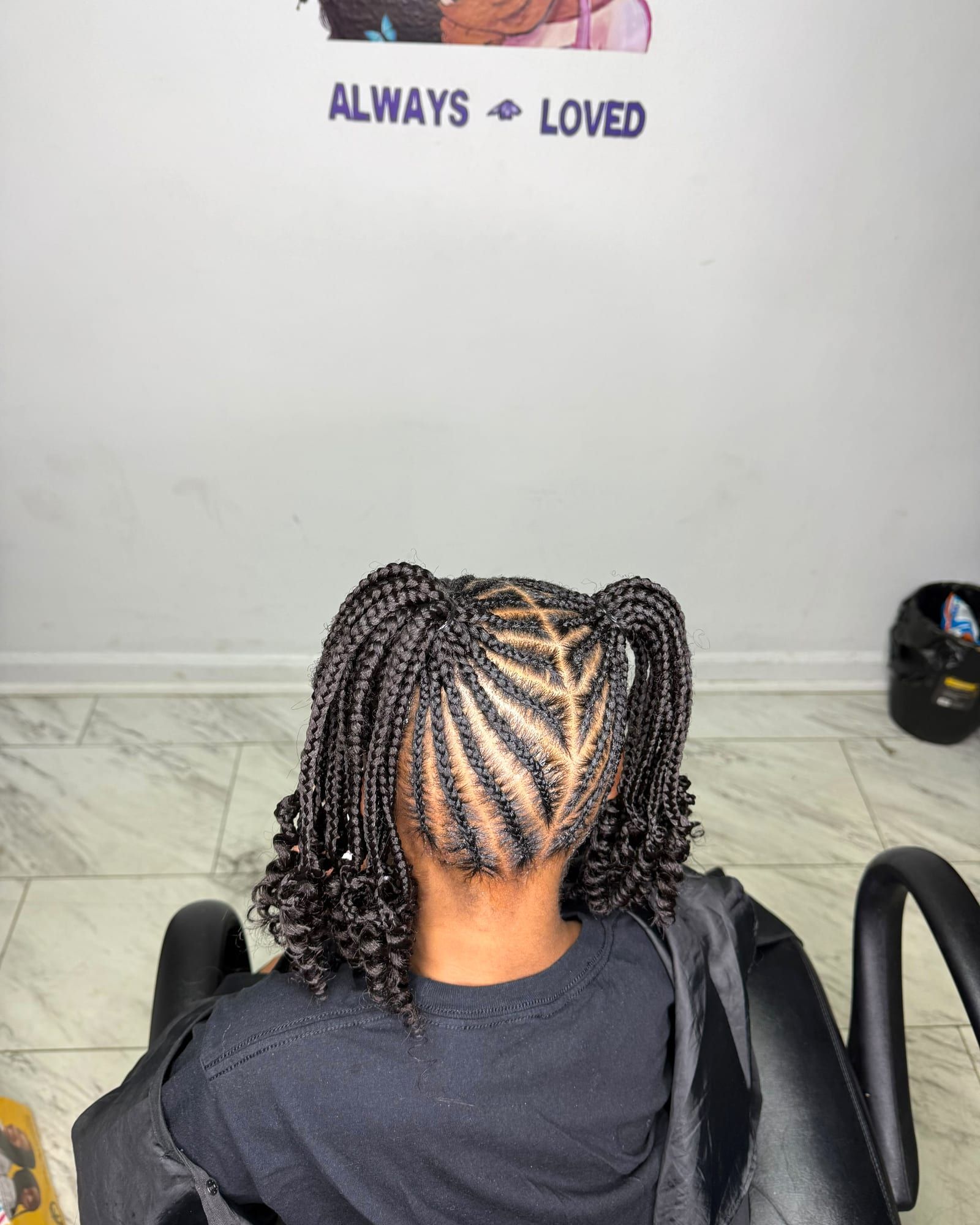 Kids braided pigtails with curly ends