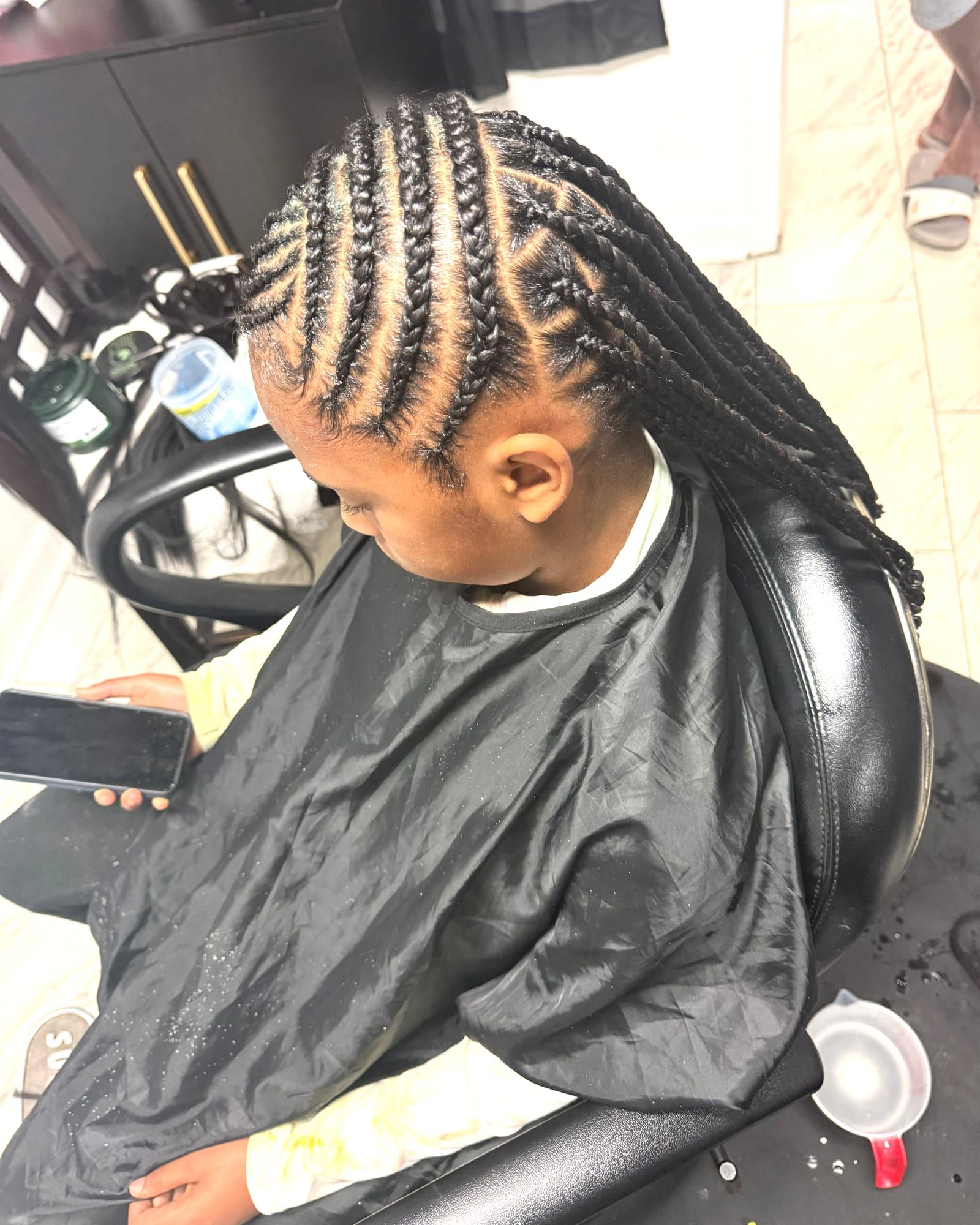 Feed-in cornrows flowing into long braids