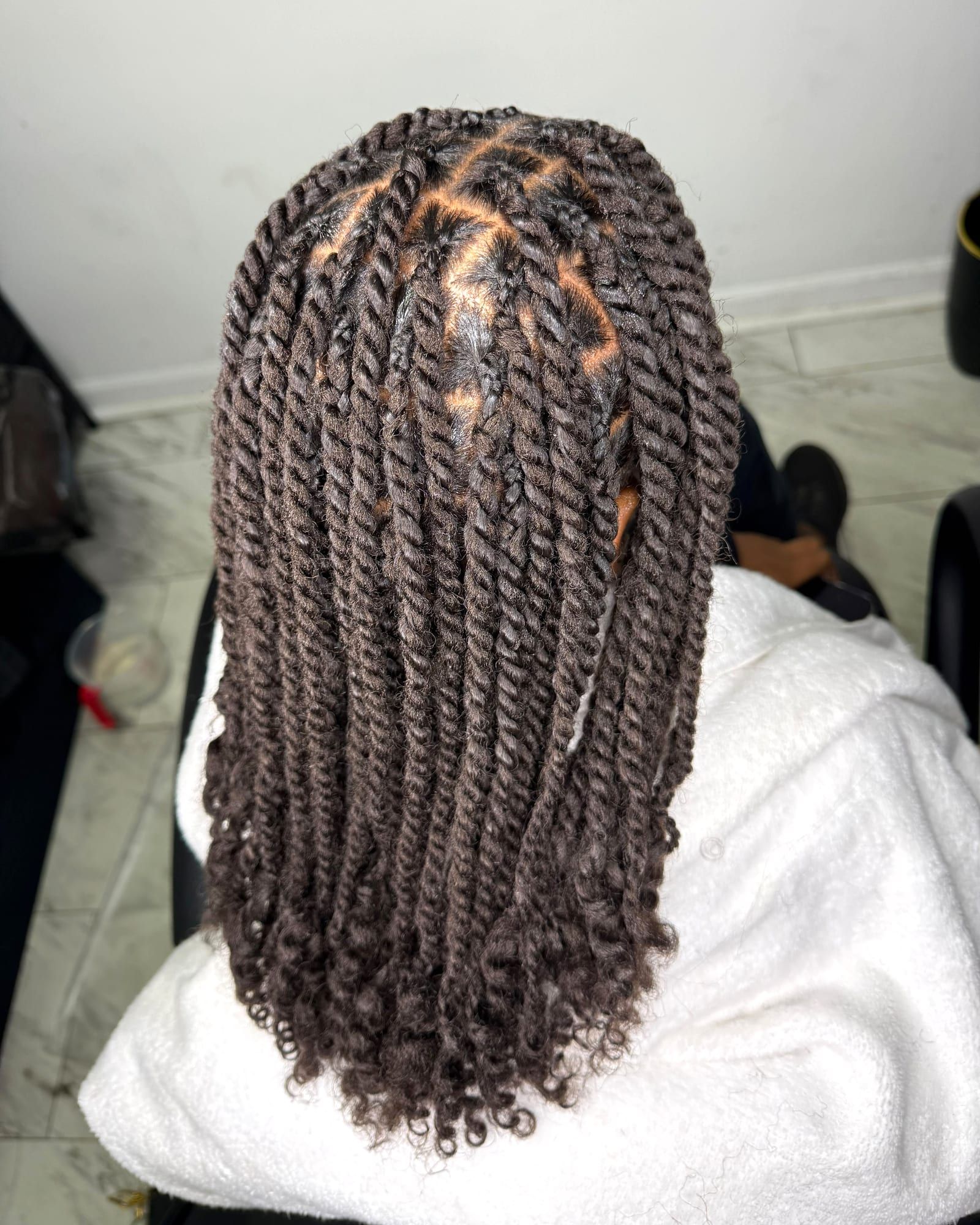 Two-strand twists with criss-cross parting