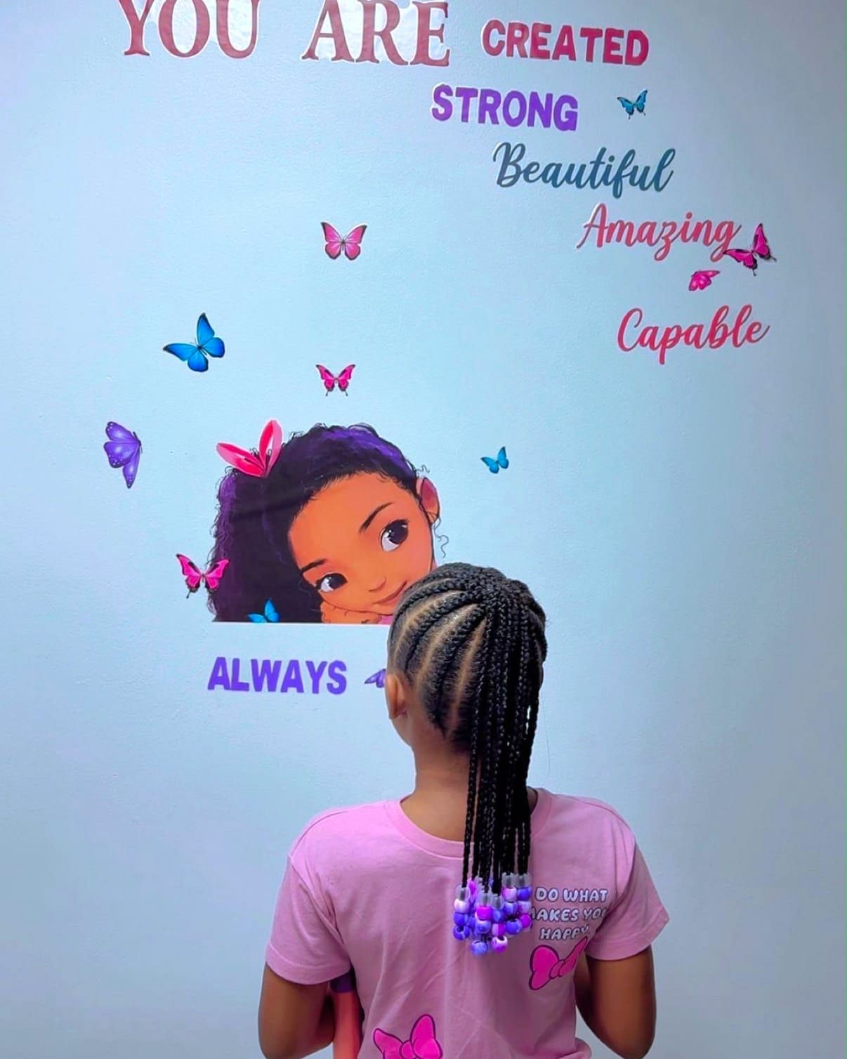 Kids cornrows into a ponytail