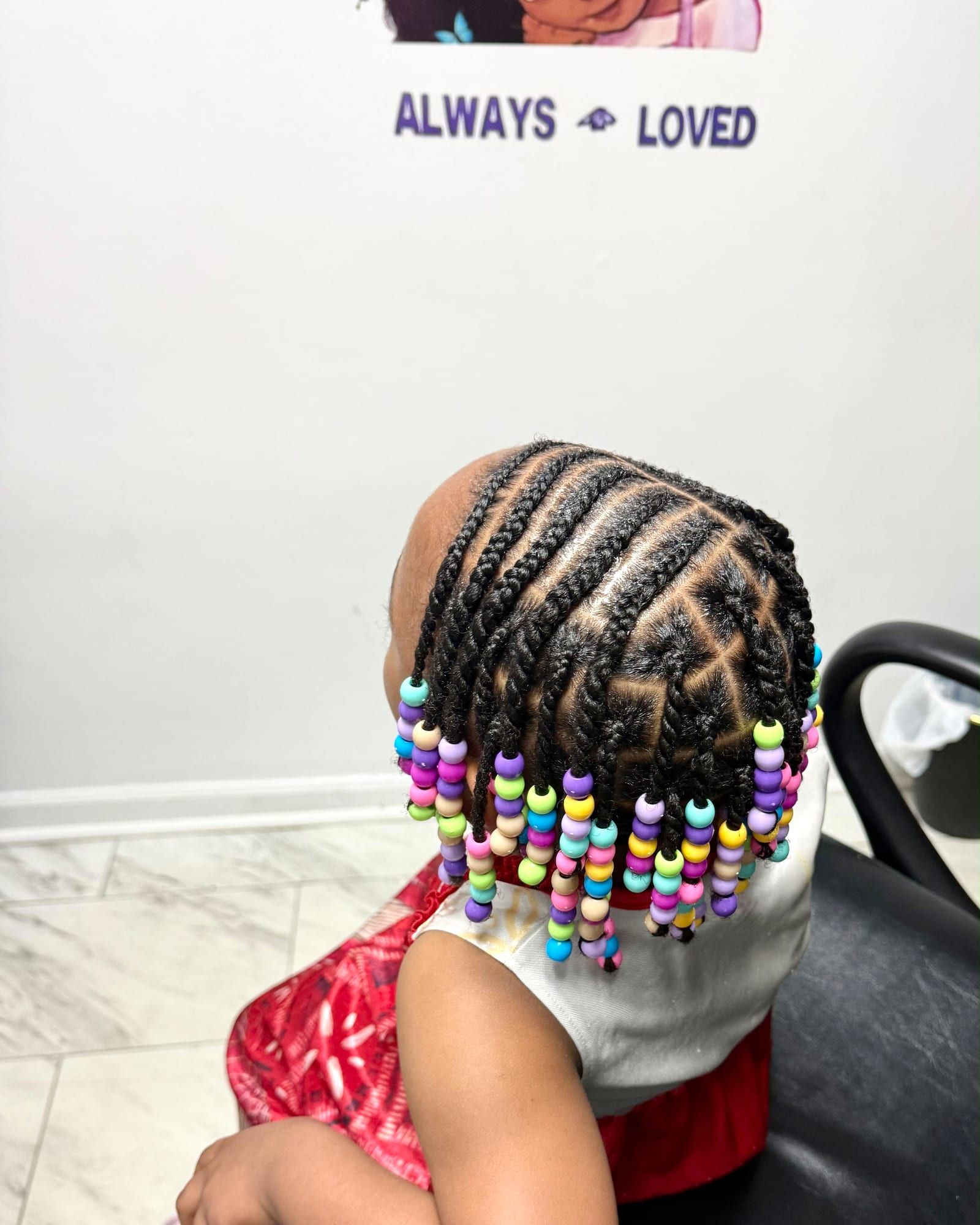 Kids cornrows finished with colorful beads