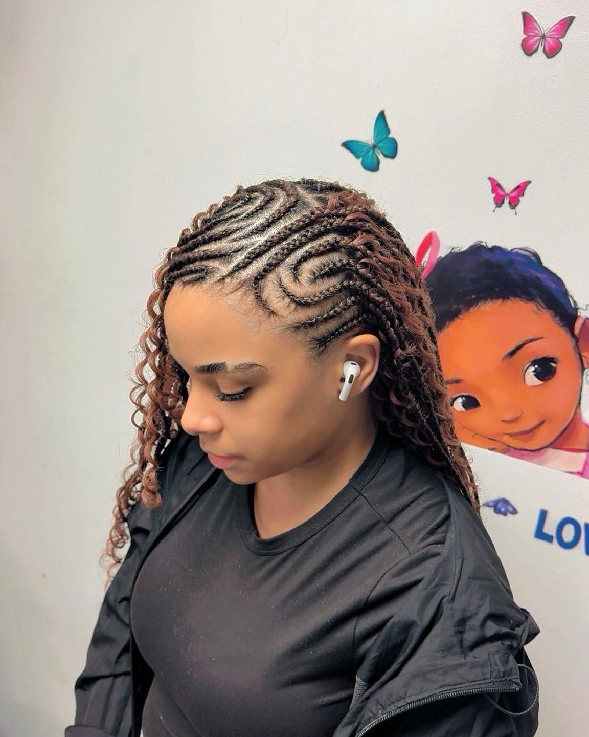 Tribal bohemian braids with sculpted cornrows at the front, side view